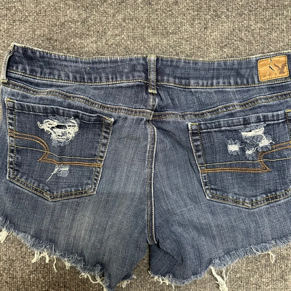 American Eagle Denim Shorts Womens Size 14 Long Dark Wash Distressed Cut Off
